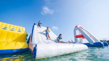 Enjoy a thrilling water slide experience in our pool.