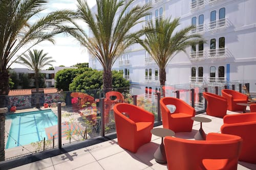 Outdoor pool, open 7:00 AM to 10:00 PM, pool umbrellas, pool loungers