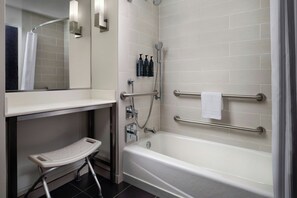 A modern bathroom with a bathtub, a shower, a vanity with a mirror, and a step stool. - Aloft by Marriott El Segundo - Los Angeles Airport (El Segundo)