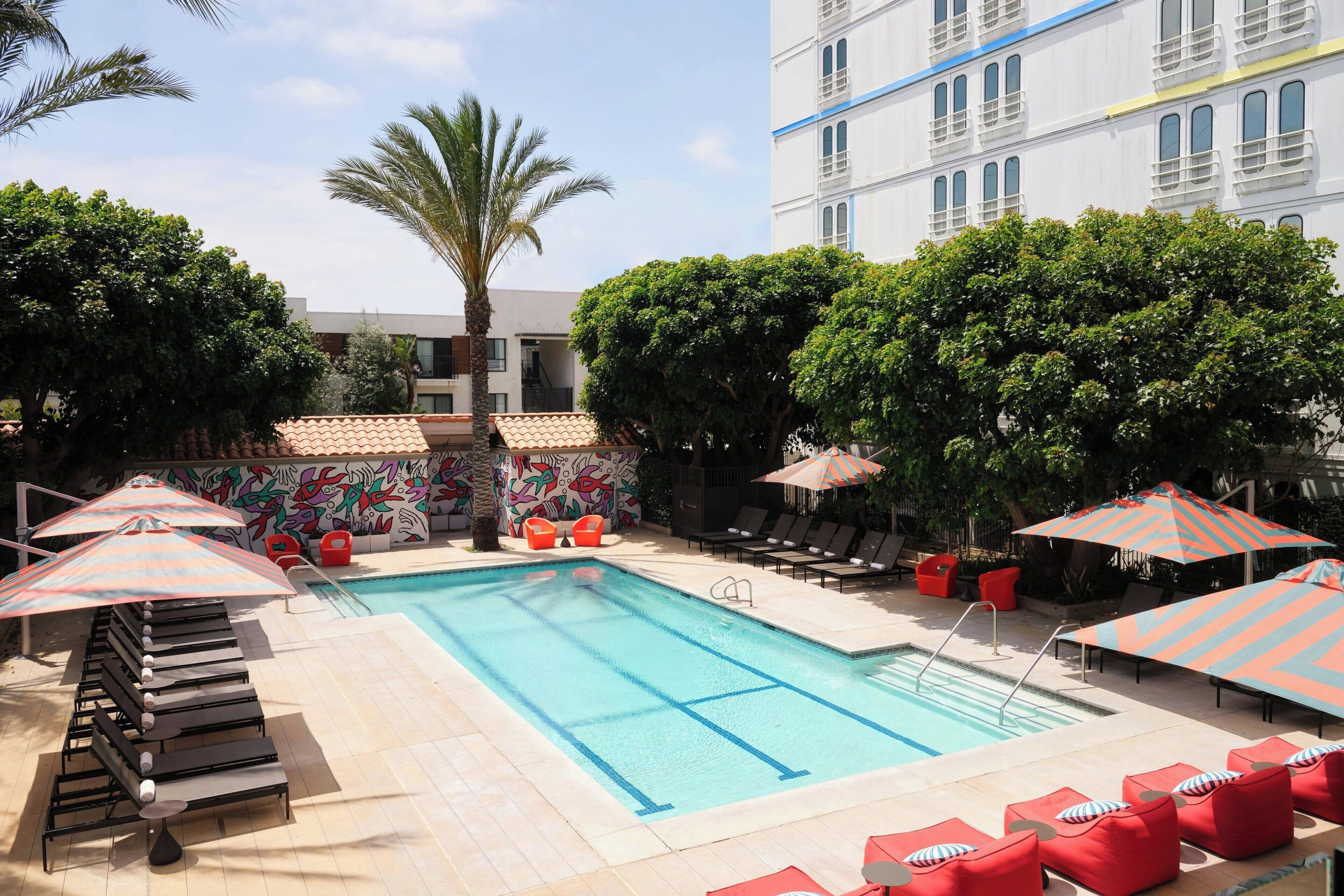 outdoor pool, open 7:00 am to 10:00 pm, pool umbrellas, pool loungers