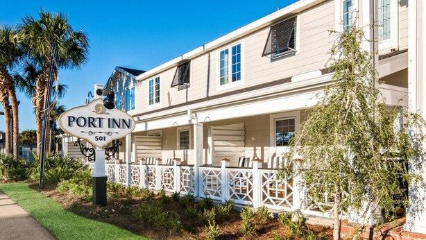 A two-story building with a sign reading 'Port Inn' and the number 501.
