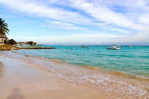 Beach nearby, white sand, beach towels