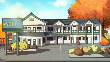 A motel with a sign, multiple floors, and a parking lot.
