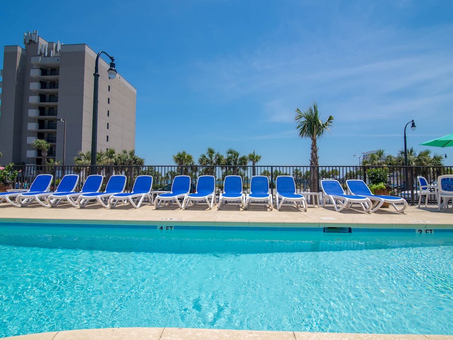 Seasonal outdoor pool, open 9:00 AM to 10:00 PM, pool loungers