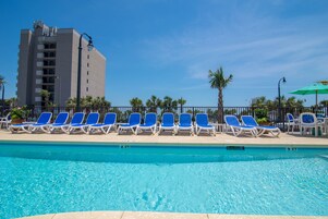 Seasonal outdoor pool, open 9:00 AM to 10:00 PM, pool loungers