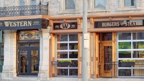A building with a Western restaurant and a Burgers and Steaks restaurant. - Western Hotel & Executive Suites (Guelph)