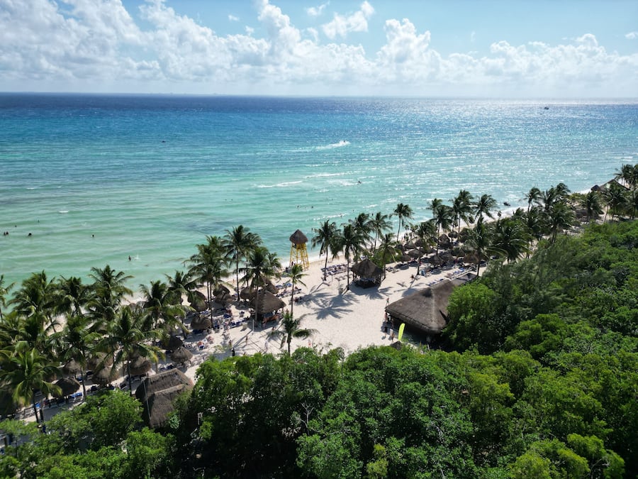 On the beach, white sand, sun loungers, beach umbrellas