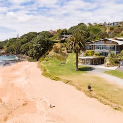 On the beach, sun-loungers, beach towels, windsurfing