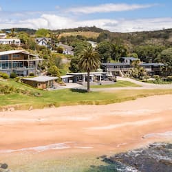 On the beach, sun-loungers, beach towels, windsurfing