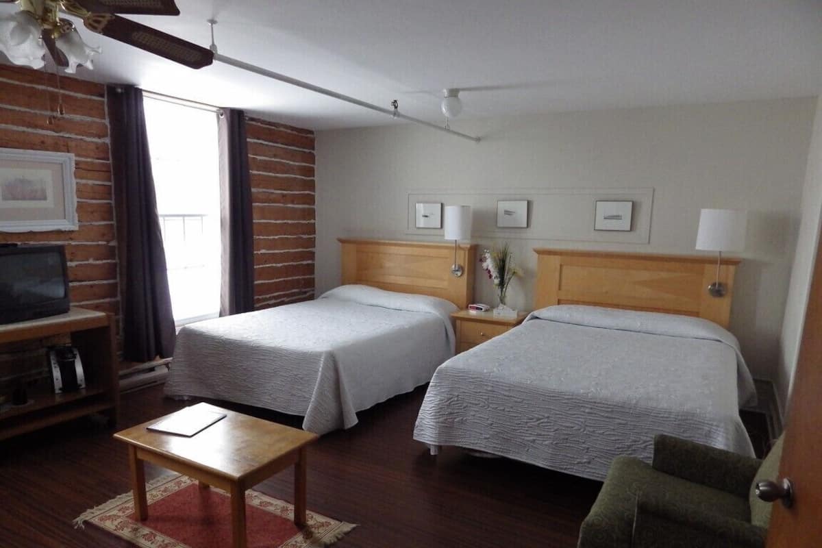 Gallery Quadruple Room | 1 bedroom, premium bedding, individually furnished, iron/ironing board