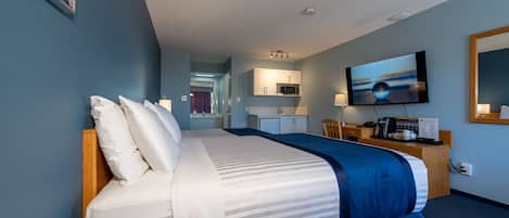 Deluxe Room, Multiple Beds, Kitchenette | Desk, laptop workspace, blackout curtains, iron/ironing board