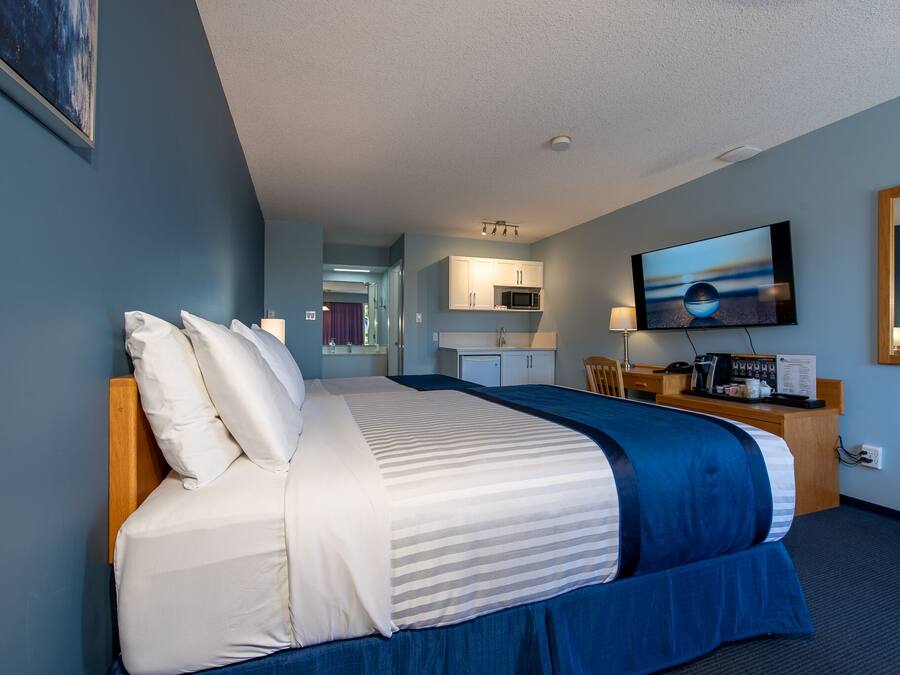 Desk, laptop workspace, blackout curtains, iron/ironing board