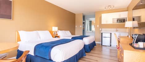 Deluxe Room, Multiple Beds, Kitchenette | Desk, laptop workspace, blackout drapes, iron/ironing board