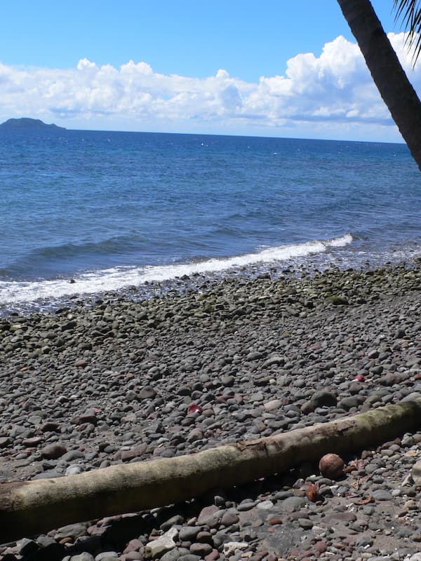 On the beach, black sand, beach towels, scuba diving
