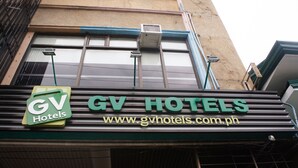 A hotel sign with the name "GV Hotels" and a website address. - GV Hotel Ormoc (Ormoc)