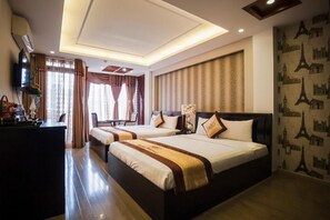 Family Triple Room, Balcony | Minibar, in-room safe, desk, blackout drapes - Hoang Dung Hotel – Hong Vina (Ho Chi Minh City)