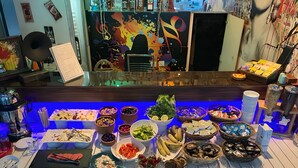 A buffet with various food items and a coffee station. - La Bella Suite Hotel (Kusadasi)
