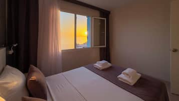 Luxury Suite, 1 Bedroom, Sea View | 1 bedroom, minibar, desk, laptop workspace