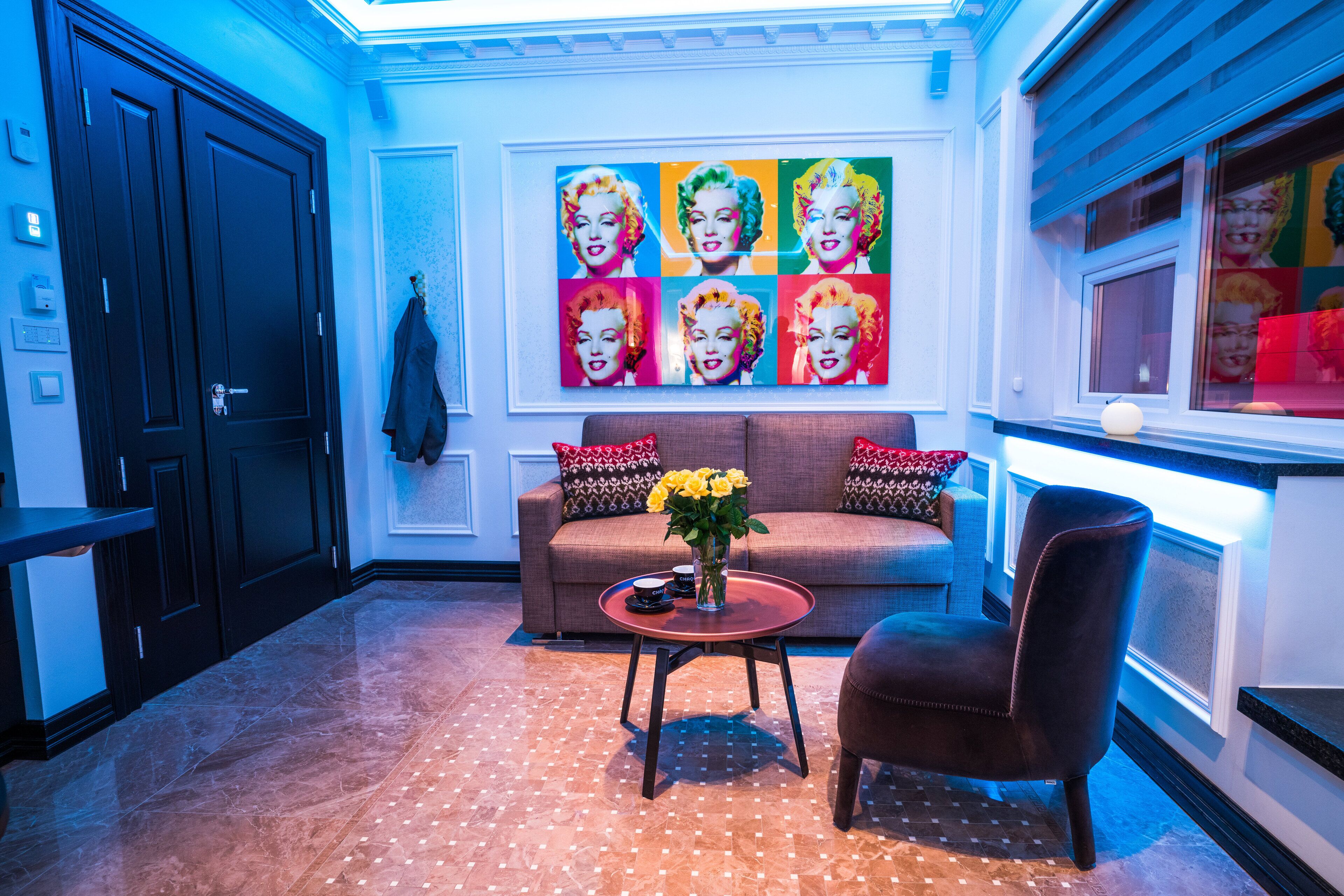 sapphire suite - free spa access | living room | 42-inch flat-screen tv with cable channels, tv, ipod dock