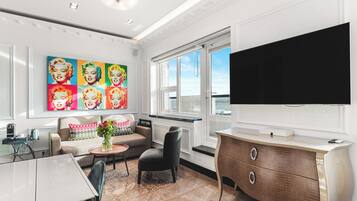 Sapphire Suite - Free Spa Access | Living area | 42-inch flat-screen TV with cable channels, TV, iPod dock