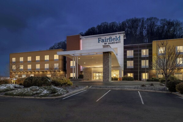 A Fairfield by Marriott hotel with a modern facade, a covered entrance, and a parking lot.