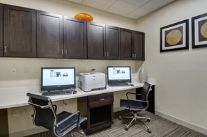 A conference room with two desktop computers, a printer, and two office chairs. - Hampton Inn & Suites Springfield/Downtown (Springfield)