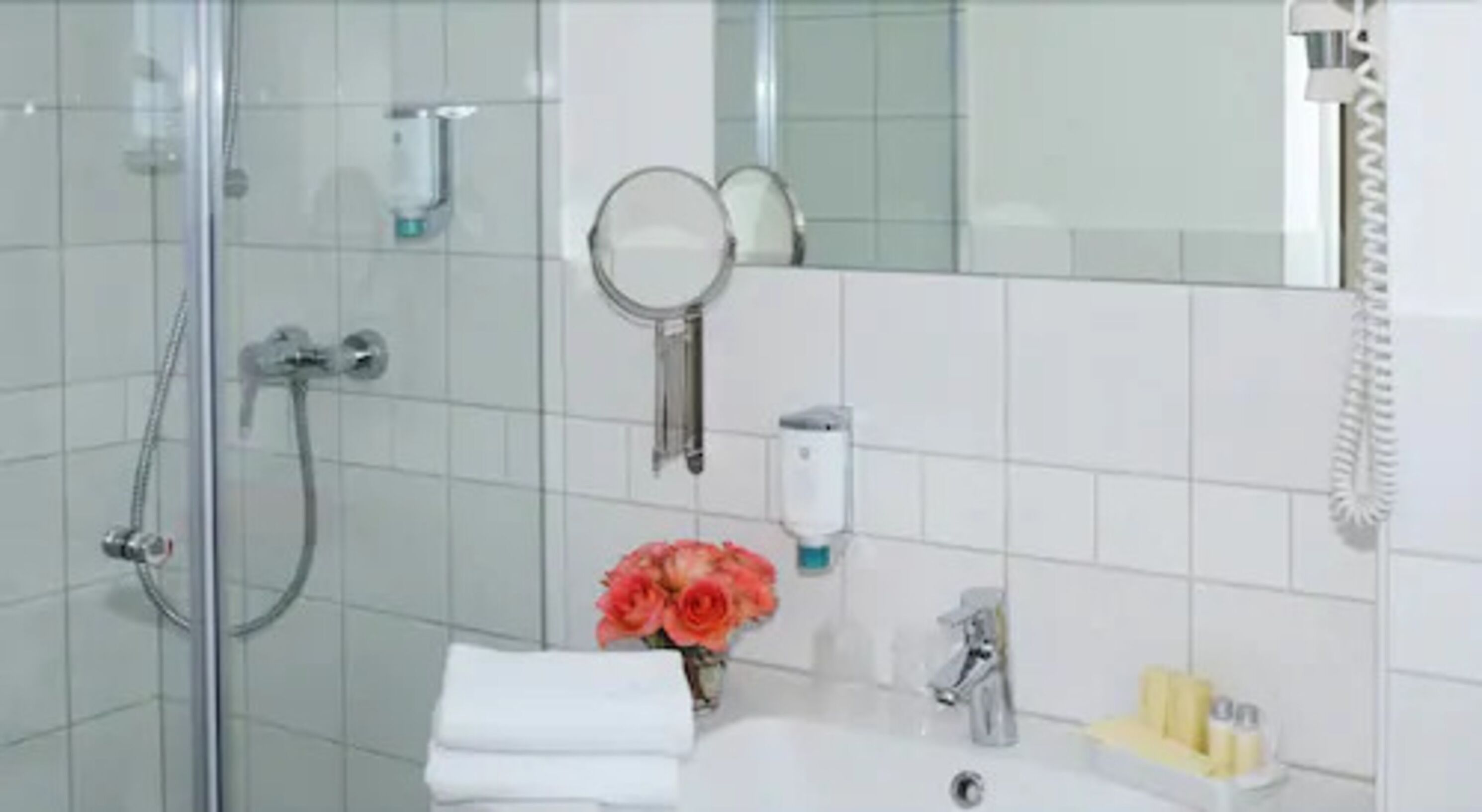 shower, designer toiletries, hair dryer, slippers