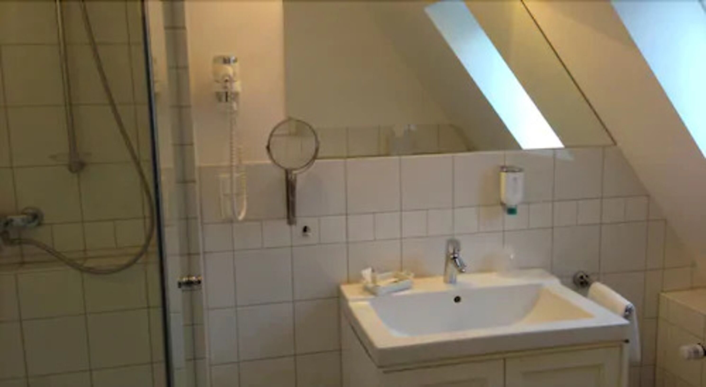 shower, designer toiletries, hair dryer, slippers