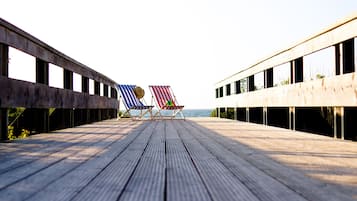 On the beach, sun loungers, fishing
