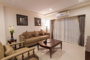 Suite, 1 Bedroom | Living area | 40-inch TV with cable channels - SN Plus Hotel - SHA Plus (Pattaya)