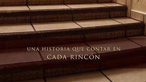 A staircase with a patterned design, leading to a room with a painting and a sign for Casa de Oracion San Jose Hotel. - Hotel Casa de Oración San José (Puebla)