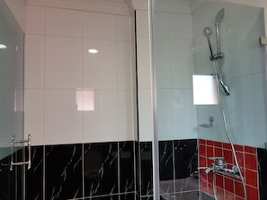 Shower, rainfall showerhead, hair dryer, towels