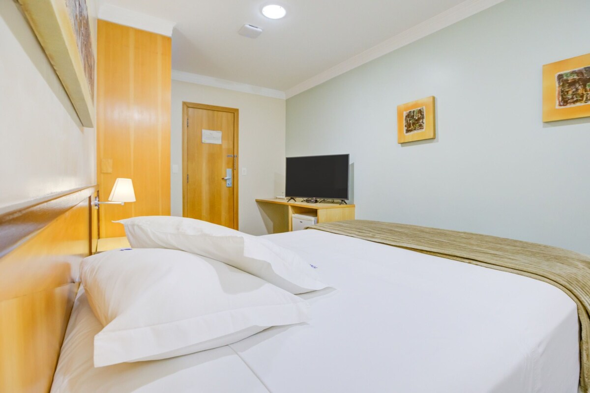 Standard Double Room | Minibar, in-room safe, desk, blackout drapes