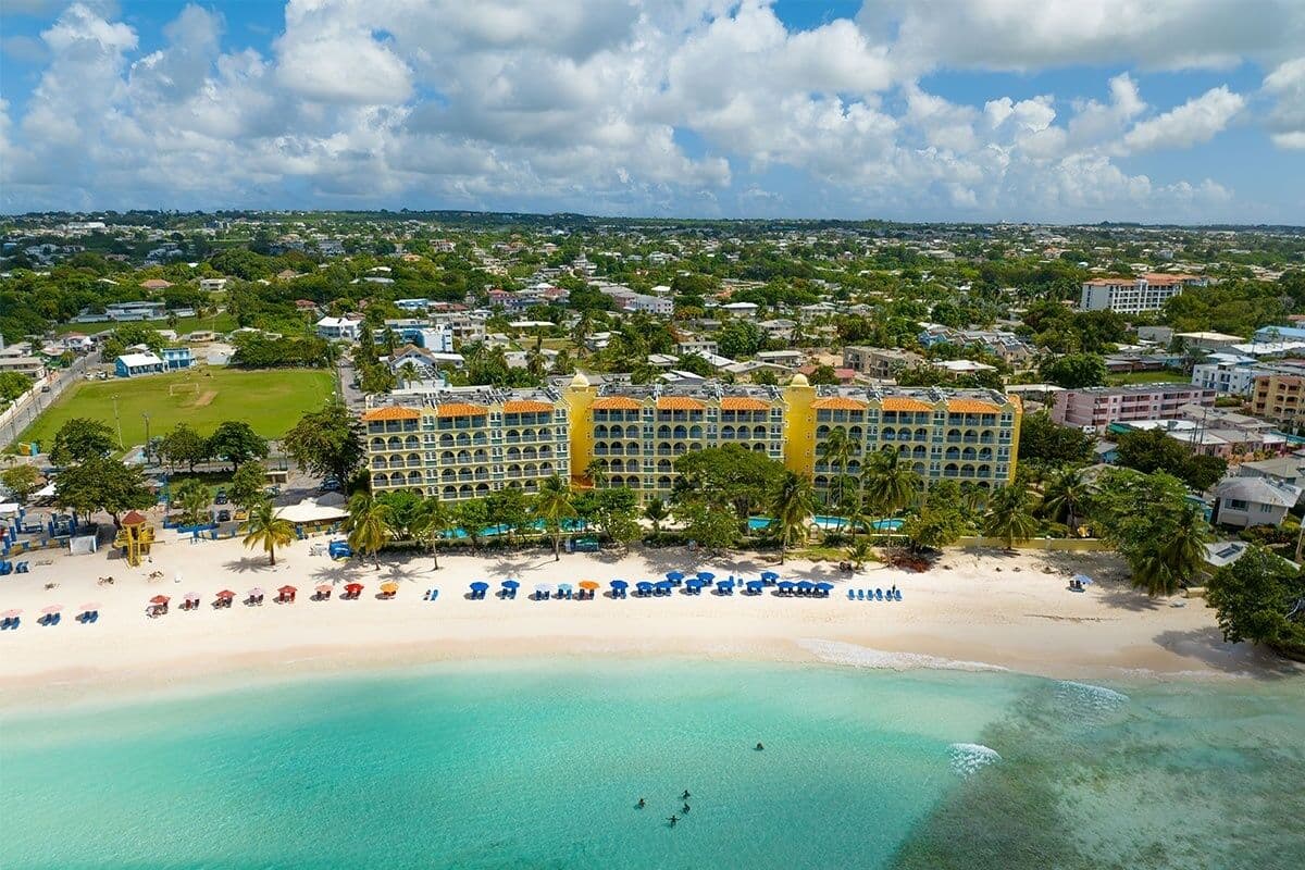 On the beach, white sand, sun loungers, beach umbrellas