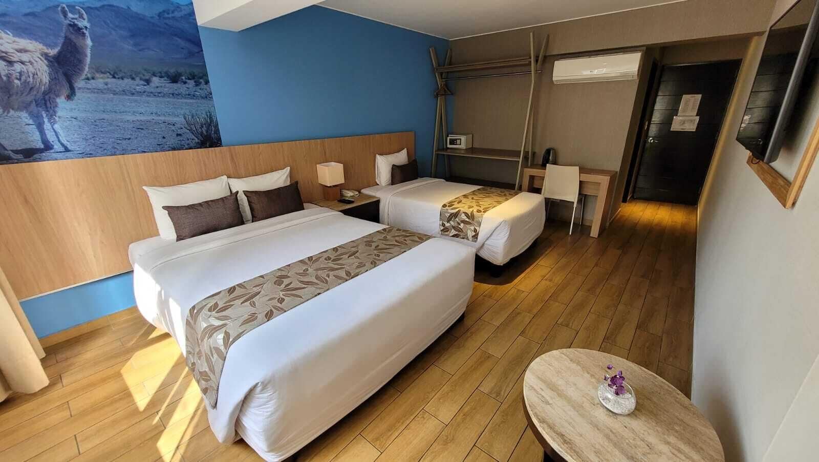 family triple room, 1 bedroom, city view | 1 bedroom, premium bedding, down duvets, in-room safe