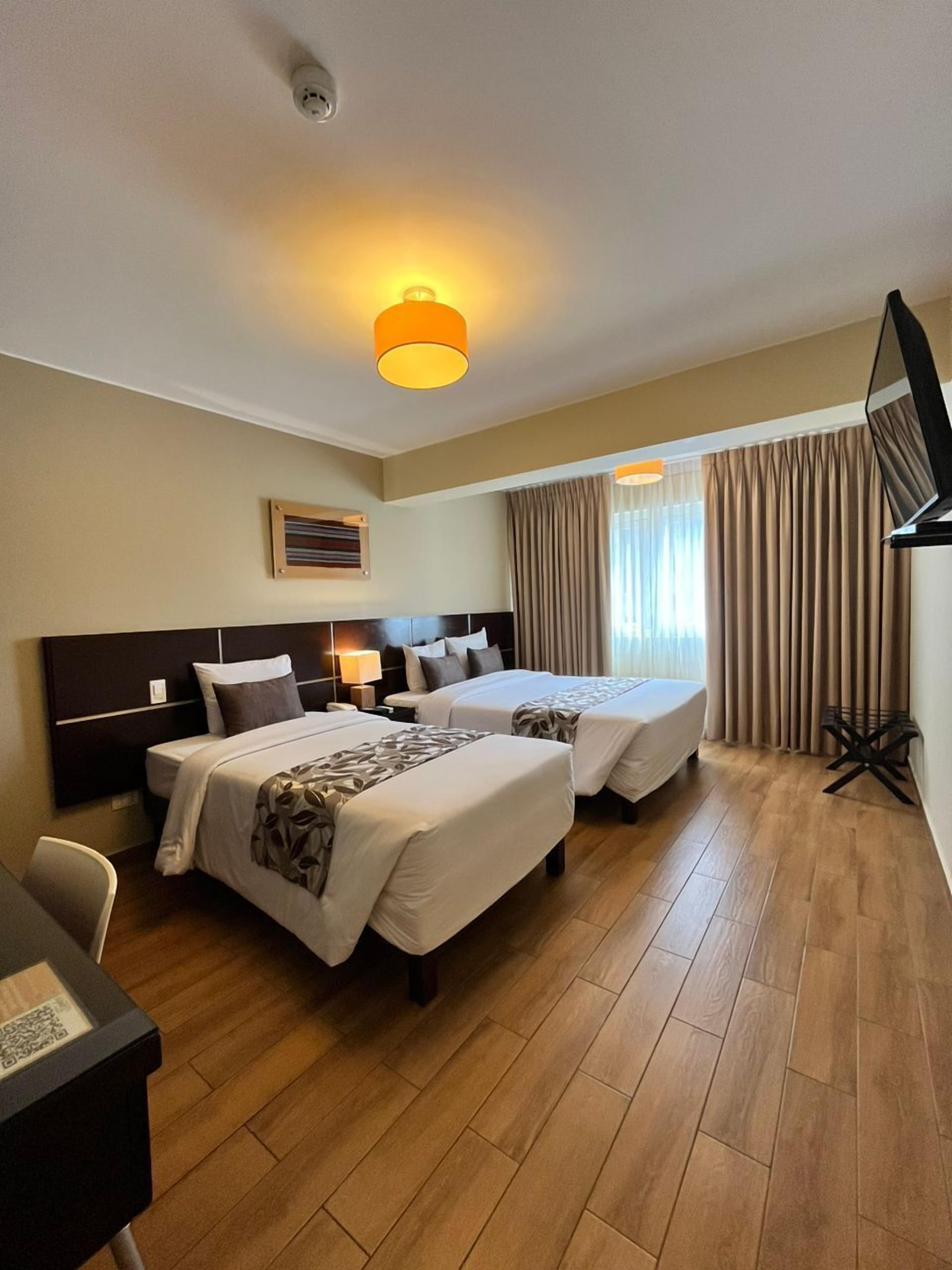 family triple room, 1 bedroom, city view | 1 bedroom, premium bedding, down duvets, in-room safe