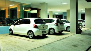 A parking garage with white cars parked in rows. - Able Resident Hat Yai (Hat Yai)