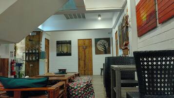 Garden View Room | Living area | 24-inch LCD TV with cable channels, TV