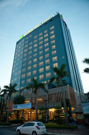 A high-rise hotel with a modern glass facade, multiple floors, and a prominent sign at the top. - Muong Thanh Xa La (Hanoi)