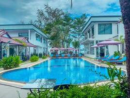 Outdoor pool, open 6:00 AM to 9:00 PM, pool umbrellas, sun loungers