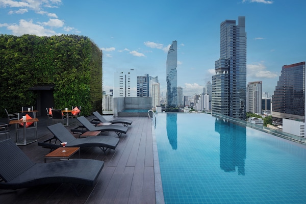 Outdoor pool, open 6:00 AM to 8:00 PM, pool loungers