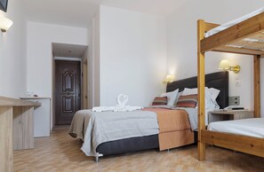 A bedroom with a wooden bunk bed, a desk, and a wardrobe. - Begeti Bay (Rethymno)