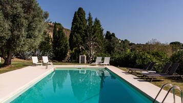 Seasonal outdoor pool, open 8:00 AM to 8:00 PM, pool umbrellas