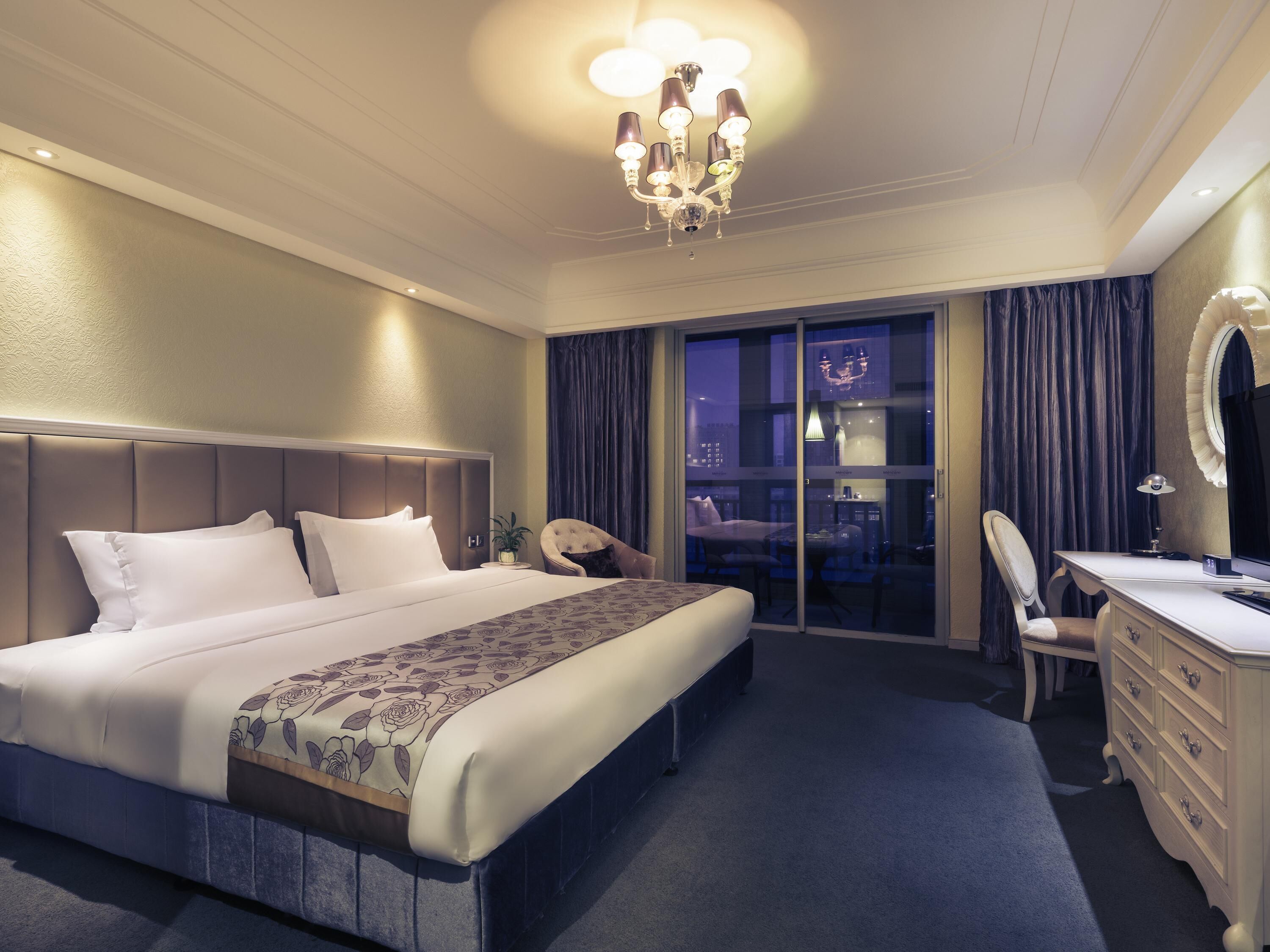 Deluxe Room, 1 King Bed | In-room safe, individually decorated, desk, iron/ironing board