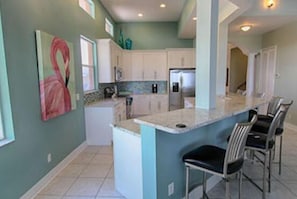 Treasure Island Beach Villa (4 Bedroom Luxury Beachfront Home) | Private kitchen | Full-size fridge, microwave, stovetop, coffee/tea maker