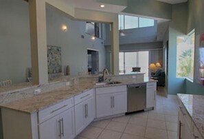 Treasure Island Beach Villa (4 Bedroom Luxury Beachfront Home) | Private kitchen | Full-size fridge, microwave, stovetop, coffee/tea maker