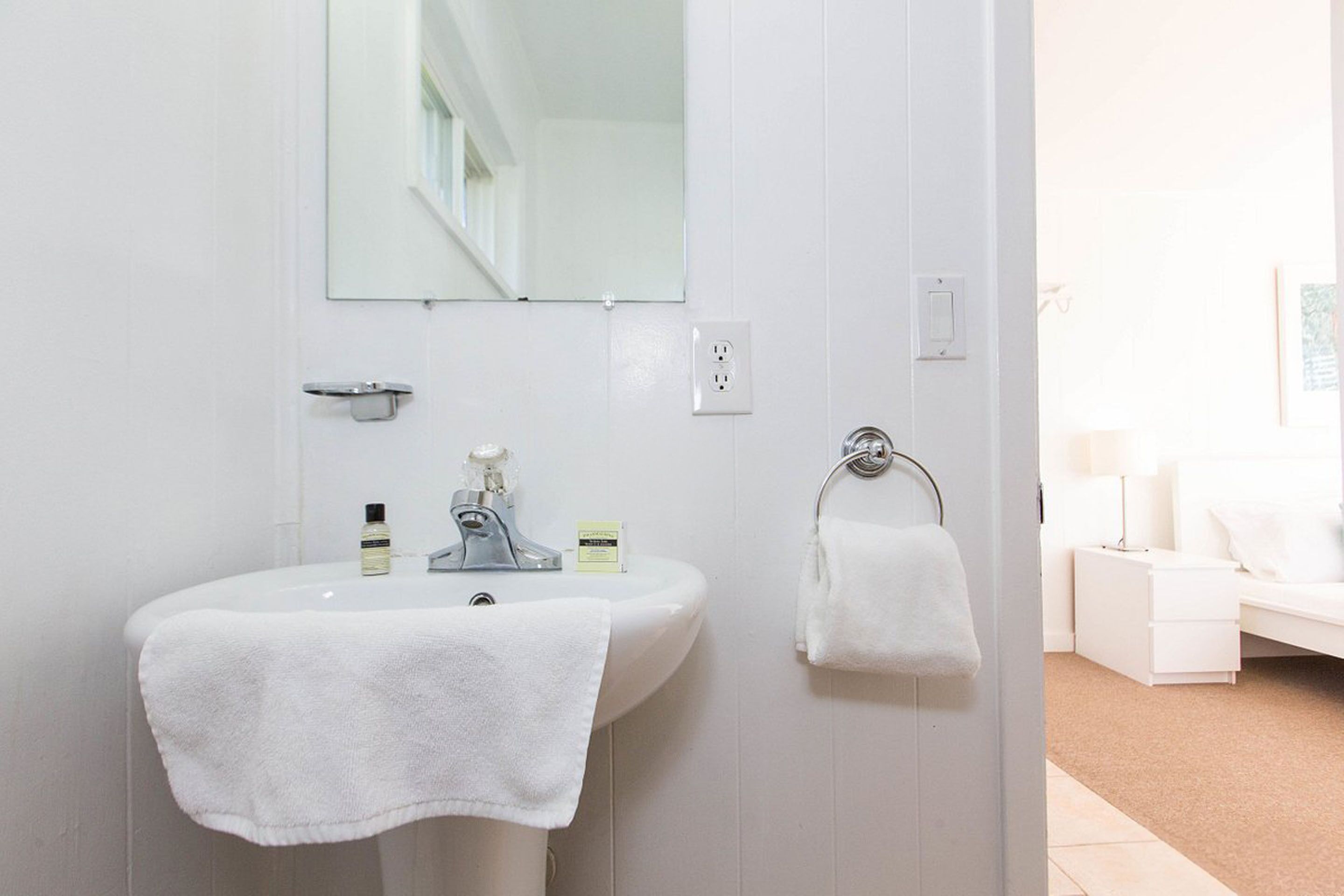 designer toiletries, hair dryer, bathrobes, towels