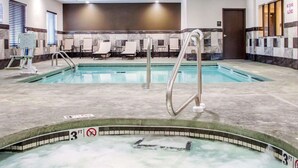 An indoor swimming pool with a 3 FT depth marker, lounge chairs, and a spa area. - Comfort Inn & Suites Woodward (Woodward)