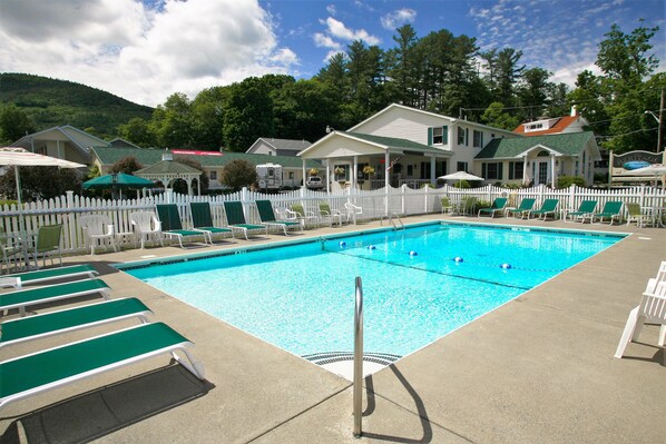 Outdoor pool, open 10 AM to 10 PM, pool umbrellas, pool loungers