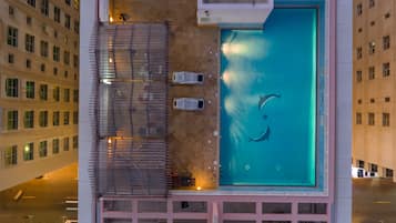 Outdoor pool, open 9:00 AM to 9:00 PM, pool umbrellas, pool loungers